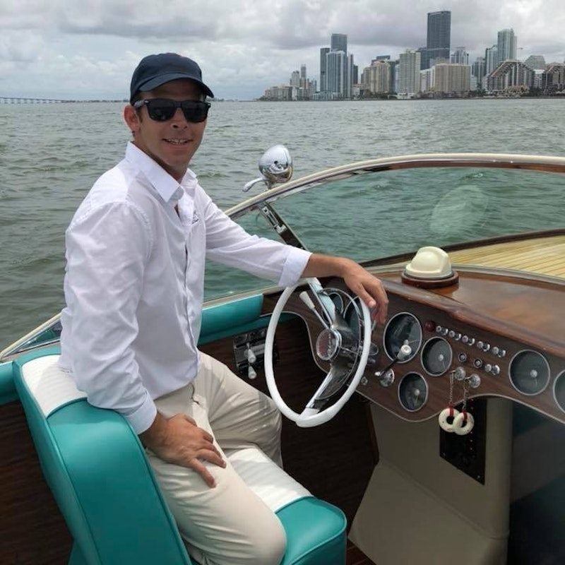 greg behind boat helm