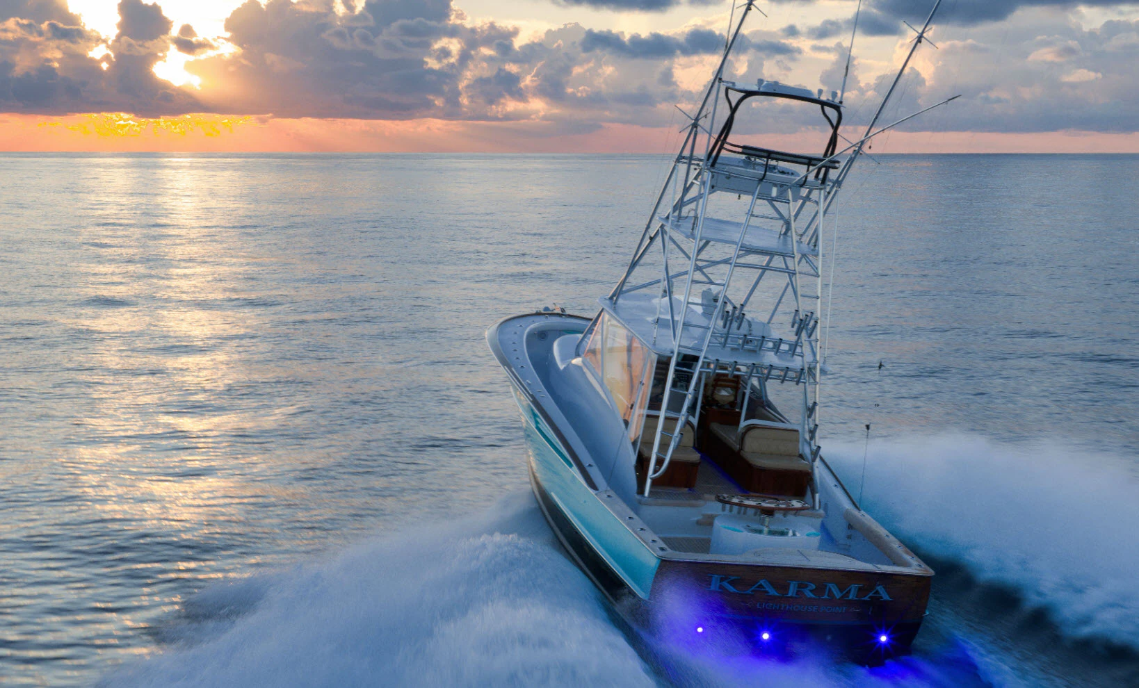 winter custom sportfish named karma cruising at sunset